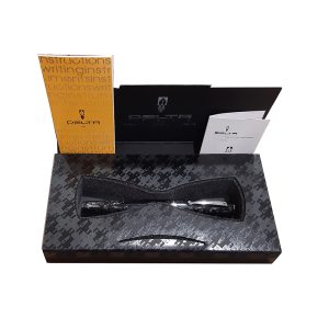 The Delta Intesa Stone Black Rollerball Pen. Once again Delta introduces a new array of writing instruments designed to meet the expectation of every pen collector. Each of these unique pens is crafted from hand turned Italian resins in beautiful marble colors. To admire its beautiful design, the pen features rhodium trims and Delta’s signature clip that ensures perfect hold of the pen in your pocket without any free movements. Intesa comes in three distinct modes: twist ballpoint, capped rollerball and fountain pen. Choose from four colors: Stone Black, Blue Pearl, Brown Marble or Ivory Marble. Colour : Stone Black Resin Rhodium Trim Capped rollerball Rolls into pocket with ease Special Resin Gift box