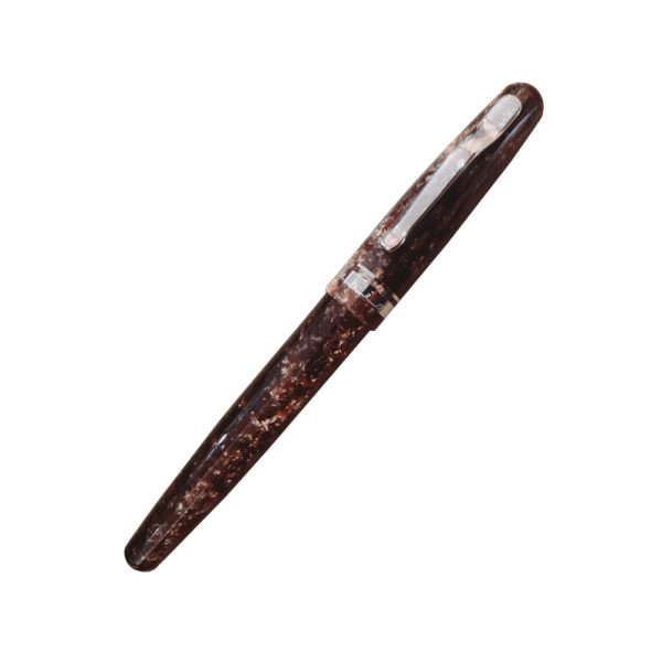 The new Fusion 82 may look like the traditionally handcrafted writing instruments from Delta – but it is so much more! The fountain pen holds the patent-pending Fusion nib – a revolution in design by Delta. The nib was developed to improve the efficiency of the fountain pen by enhancing the physical-chemical properties of ink within its assembly system. The foundation of the Fusion nib is a steel alloy covered and decorated with a layer of precious 18K gold: the ink is made more viscous on the tip of the nib because the thermal conductivity of the precious metal plate will heat the underlying steel – the higher temperature makes the ink flow more smoothly. The combination of gold and steel on the flexible nib gives it a unique and appealing look. It is strong and durable for long writing sessions – much more so than solid gold nibs. Hence, the fountain pen is more precious and at the same time less expensive! Fusion 82 is one of the collections chosen to launch Delta’s new and innovative nib. The writing instruments are turned by hand from solid bars of special resin and polished to a mirror finish in three colors: blue and brown marble and solid black. Colour – Marbled Brown Nib : Medium 18kt Fusion nib Brown Resin with Rhodium trim Fill Mechanism: Cartridge & Converter Pen come with Delta Gift Box Made in Italy 