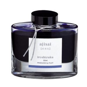 Pilot Iroshizuku 50ml Ink Bottle - Ajisai, Hydrangea (Blue Purple) The name Iroshizuku is a combination of the Japanese words Iro (Coloring), expressing high standards and variation of colors, and Shizuku (Droplet), that embodies the very image of dripping water. Each ink name derives from the expressions of beautiful Japanese natural landscapes and plants, all of which contribute to the depth of each individual hue. Ajisai evokes the beautiful blue-purple petals of the hydrangea flower, some species of which are native to Japan. Colour : Periwinkle (Blue Purple) Ink Colour : Hydrangea (Ajisai) Created using the highest standards and variations of color Ink names derived from Japanese natural landscapes and plants Enjoy the intense and subtle colors of Japan as you write Works well with Pilot and Namiki fountain pens Each 50ml bottled ink is made from hand blown glass Angled etched bottle bottom allows pen to use virtually every drop of ink Made in Japan