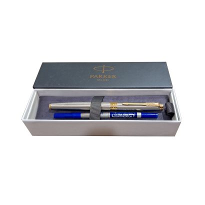 Parker Aster Brushed Metal Gold Trim Rollerball Pen, Parker Aster Roller Ball Pen With Brushed Metal Finish Brushed Metal Barrel And Gold Plated Trim. A Contemporary & Unique Design Blended Highlighted With A Gold Plated Ring On The Barrel. Body Colour : Brushed Metal Gold Plated trim for premium look Cap on/off A contemporary and unique design blended highlighted with a gold plated ring on the barrel Country of Origin: India