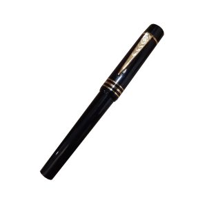 Onoto Magna Classic Black with Gold Plated Trim Light Weight Rollerball Pen - Based on the style and shape of one of the most famous fountain pens ever made – the Onoto Magna of 1937 which is still acclaimed by many as the best fountain pen ever made – this Magna Classic has 3 gold-plated sterling silver cap bands with the gold-plated sterling silver Onoto Chevron clip. Hold the Magna Classic and you will marvel at its perfect balance and how tactile it feels – it is also one of the most robust pens on the market today, thanks to its durable, high-density acrylic composition. The distinctive Onoto logo is carved into the gold-plated sterling silver cap button with a frosted background, making it instantly recognisable, and a gold-plated sterling silver barrel button finishes the overall luxury feel. Body Colour : Black/Gold Edition No. - 112 Material – High-density acrylic with gold-plated sterling silver fittings Cap fittings – Gold-plated hallmarked sterling silver bands Clip – 23ct gold-plated sterling silver with Onoto cipher Barrel fittings - 23ct gold-plated button Tip : Rollerball Made in England by Onoto