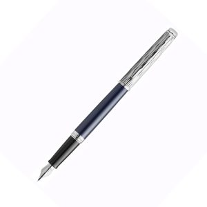 The Waterman Hemisphere L'Essence Du Bleu CT Fountain Pen is a stylish and elegant writing instrument produced by Waterman. the fashionable L’Essence du Bleu Hémisphère fountain pen is finished in a vibrant, deep blue lacquer with Waterman’s signature wave pattern chiselled into the metal cap. The fountain pen feature the Waterman double-branched clip, stainless steel nib with the looped W Waterman design and complemented by palladium trim. Waterman Hemisphere L'Essence Fountain Pen is a presented in a prestige gift box. Deep Blue colour  Lacquer coated Brass barrel with a signature wave pattern on the cap Palladium plated cap and trim It uses standard size converter or cartridges Engraved Stainless steel nib - Fine  Fountain pen is presented in a beautiful waterman gift box. Country of Origin: India