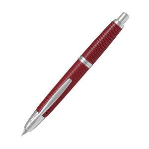 Pilot Capless Kasuri Red Rhodium Trim Fountain Pen a.k.a Carbonesque in Europe due to the similarity of a carbon-fibre finished. This finish is actually known as the Kasuri in Japan. Kasuri is a Japanese word for fabric that has been woven with fibers dyed specifically to create patterns and images in the fabric. It is an ikat (resist-dyeing) technique. The patterns are characterized by a blurred or brushed appearance which is reflected in this pen. Body Colour: Kasuri Red Series: Capless Kasuri (kasuri) Product Number : 2080 - 1500RRR-F-R Material : Metal Trim : Rhodium Cap Type : Capless Nib : 18Kt rhodium-plated gold Fine Nib Converter Included : Yes Method - Knock type Fill Mechanism : Cartridge/Converter (CON-40 *Cartridge ink can also be used.) Packaging Type : Gift Box Packaging Made in Japan