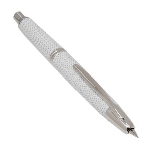 Pilot Capless Kasuri White Rhodium Trim Fountain Pen a.k.a Carbonesque in Europe due to the similarity of a carbon-fibre finished. This finish is actually known as the Kasuri in Japan. Kasuri is a Japanese word for fabric that has been woven with fibers dyed specifically to create patterns and images in the fabric. It is an ikat (resist-dyeing) technique. The patterns are characterized by a blurred or brushed appearance which is reflected in this pen. Body Colour: Kasuri White Series: Capless Kasuri (kasuri) Product Number : 2085 - 1500RRR-M-W Material : Metal Trim : Rhodium Cap Type : Capless Nib : 18Kt rhodium-plated gold Medium Nib Converter Included : Yes Method - Knock type Fill Mechanism : Cartridge/Converter (CON-40 *Cartridge ink can also be used.) Packaging Type : Gift Box Packaging Made in Japan