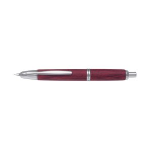 The Pilot Capless Wooden features an exclusive finish made from resin-impregnated toughened material derived from birch wood. With no cap, the 18 Karat rhodium plated gold nib retracts with a simple click. The first retractable fountain pen, the Capless, spent 6 years in development before its launch in 1963. The upper barrel of this precision instrument alone is made up of 18 components. Winner of the Japanese award for high technology in 1965, this legendary pen has gone on to conquer the world. One click deploys the nib, a second click retracts the nib, providing perfect leak-tightness, even without a cap. The ink never dries up, and the Capless is always ready for use. This is a product of unprecedented appeal and practicality. Product Number - 2073 - FC-2500RR-M-DR Red birch wood with rhodium trim Innovative push-button mechanism retracts and extends nib Sealed chamber protects nib and prevents leaks and drying 18k rhodium plated solid gold nib Fitted with ink converter for use with bottled ink Cartridge cover must be fitted over the cartridge during use Presented in premium Pilot Capless presentation box
