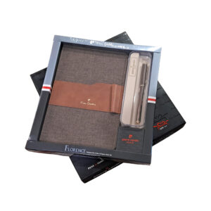 Simply and elegantly designed A5 diary with weave finish hardcover in two attractive and most preferred colours stands out for its design elements. Matching broadband securely holds business Card and Pen, in the provided pen loop. Sturdily bonded diaries with weave texture and neat stitching will make you reach out for this florence diary every day, every time. Diaries are also provided with bookmark ribbons. Alling your thoughts, feelings and get ahead of your to do lists while adding new value to your daily life! It’s a perfect gifting option for all occasions.Transform your writing style with the Wonderfully ageless Pierre Cardin Emperor Roller Pen. Light in the hand yet charmingly designed with beautiful finishes and elegant patterns, this premium roller pen provides the perfect balance of smooth effortless writing and modern style. Golden trims and premium rich body colors make this product irresistible. Glossy Brown Lacquer finish Gold-Plated Trim Transform your writing style with the Wonderfully ageless Pierre Cardin Emperor Roller Pen. Golden trims and premium rich body colors make this product irresistible Light in the hand yet charmingly designed with beautiful finishes and elegant patterns, this premium roller pen provides the perfect balance of smooth effortless writing and modern style. Roller Pen fitted with 666 Roller Refill Simply and elegantly designed A5 diary with weave finish hardcover in two attractive and most preferred colours stands out for its design elements. Matching broadband securely holds business Card and Pen, in the provided pen loop. Sturdily bonded diaries with weave texture and neat stitching will make you reach out for this florence diary every day, every time. Diaries are also provided with bookmark ribbons. Set Contains 1 Piece Brown Diary & 1 Piece Emperor Roller Pen