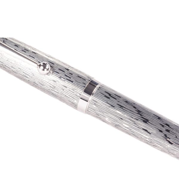 The Pilot Sterling Silver Tsumugi CT Fountain Pen is a handcrafted from genuine sterling silver. Each pen is engraved with an exquisite detailed design, a symbol chosen by Pilot to reflect an important facet of Japanese culture. “Tsumugi” has a pattern that is based on a piece of silk fabric. This fountain pen features a rhodium-plated 18k gold inlaid nib. A CON-40 converter is included with each pen, but they will also accept Pilot proprietary ink cartridges. The snap cap secures the pen when not in use and although it’s a bit heavy, it will post to make a nicely balanced pen when writing. The overall weight of a pen in the Sterling collection is around 34 grams, making it fairly comparable to the Pilot Metal Falcon. While tarnishing may be a concern given the material of the pen, the included polishing cloth will ensure easy, convenient cleaning of the pen body to keep away blemishes. The design on each pen will not hinder this cleaning either and allows for thorough, complete polishing. Model : FK5MSTUMINT Made From 925 Sterling Silver barrels and caps with Tsumugi Pattern Material: 925 Silver Snap Cap with Silver Plated trim Fountain pen comes with a Pilot CON-40 converter Nib : 18kt Gold Rhodium-plated inlaid nib Fountain pen is presented in a beautiful Pilot gift box. Brand Origin: Japan