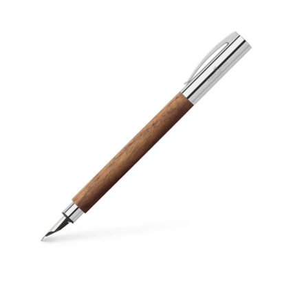 Ambition walnut wood fountain pen, M, brown The clean lines and selected materials of these slim writing implements make an excellent impression. They are distinguished by clear-cut visual design combined with professional functionalism. Barrel made of walnut wood Cap and grip made of chrome-plated polished metal Spring-loaded clip made of chrome-plated polished metal Detachable metal cap High-quality stainless steel nib in width M (medium) Equipped with a cartridge/converter system Fitted with a converter Cartridges in different colours available separately White gift box with attractive printed slip case