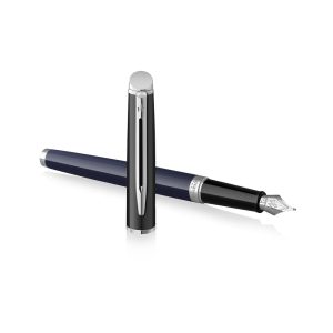 The Waterman Hemisphere Colour Block Blue/Black Fountain Pen is a brighter statement with the Hemisphere Colour Blocking collection. Taking its inspiration from this season’s boldest trend, this fashion forward fountain pen is stylishly finished in two complementary tones of blue and black. Its striking appeal is set off with the classic Waterman, signature double branched clip and stunning chrome plated trim. An engraved, chrome coated, stainless-steel nib eloquently showcases the iconic looped Waterman ‘W’. French made, this beautiful creation benefits from Waterman inhouse craftsmanship, it comes with a 2-year international warranty and is presented in a premium Waterman gift box. Fountain Pen comes with one ink cartridge and converter. Each pen is packaged in an attractive Waterman gift box. Lacquer coated Blue barrel with black cap Chrome Plated clip and trim Material: Metal It uses standard size converter or cartridges Nib : Engraved stainless-steel medium nib Fountain pen is presented in a beautiful waterman gift box. Brand Origin: France